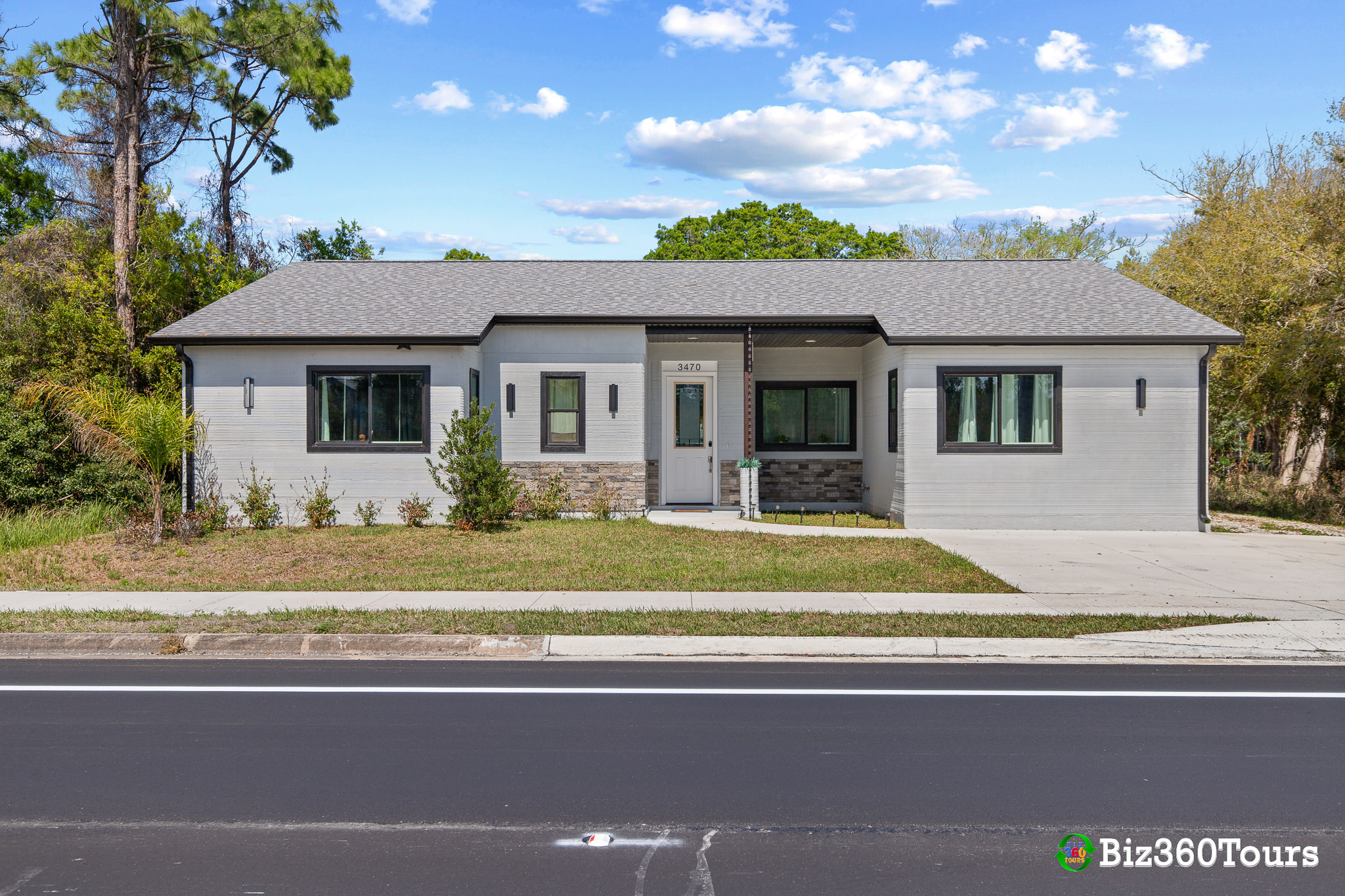 Photo of the "Frank House" a 3d printed home in Melbourne, Florida. Photo by Biz360Tours