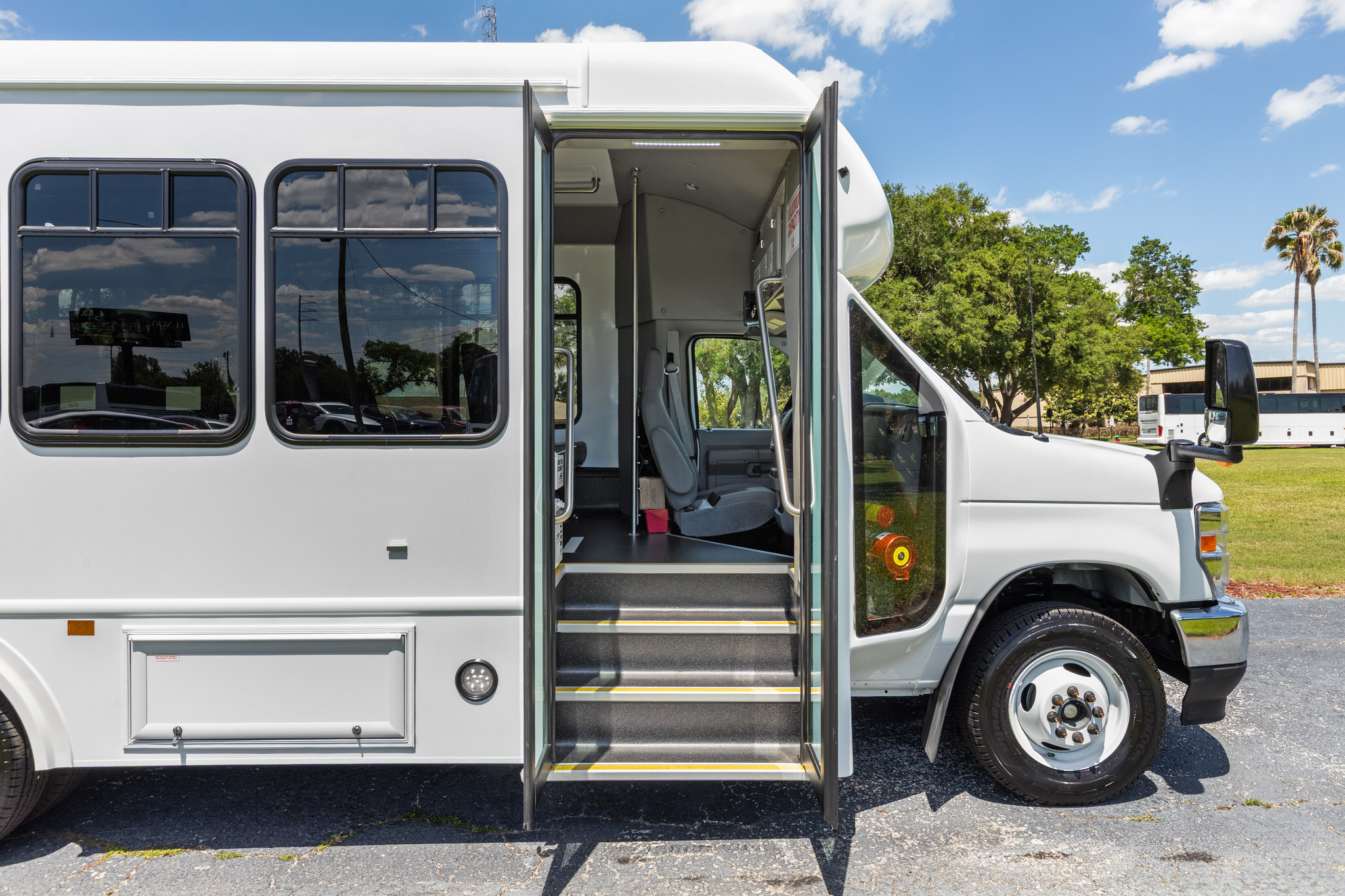 Photo of the exterior of a white Terra Transit by ABC Companies in Florida. Photo by: Biz360Tours
